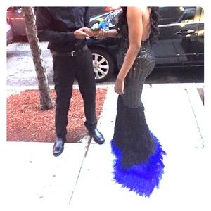 Custom made dress with trail made out of feathers